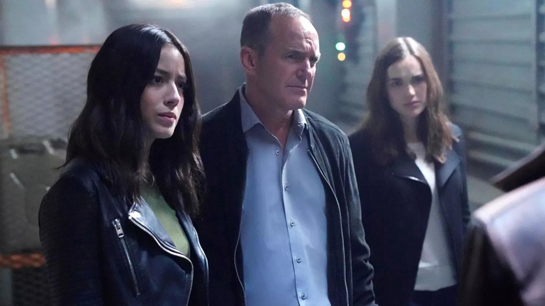 Chloe Bennet, Phil Coulson, and Jemma Simmons look concerned in Agents of SHIELD Chloe Bennet, Phil Coulson, and Jemma Simmons look concerned in Agents of SHIELD