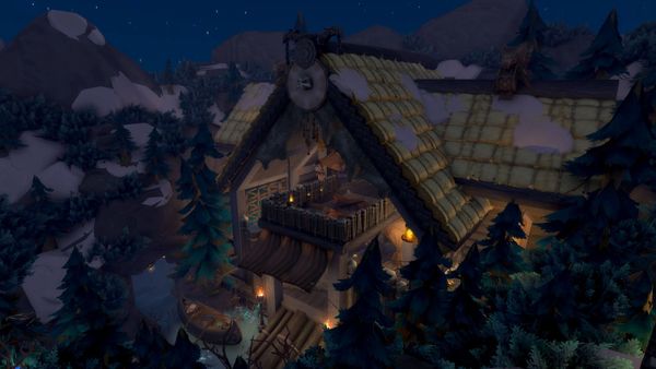 A cozy, lit-up wooden building with a steep, shingled roof surrounded by snow-covered trees in a mountainous landscape at night.